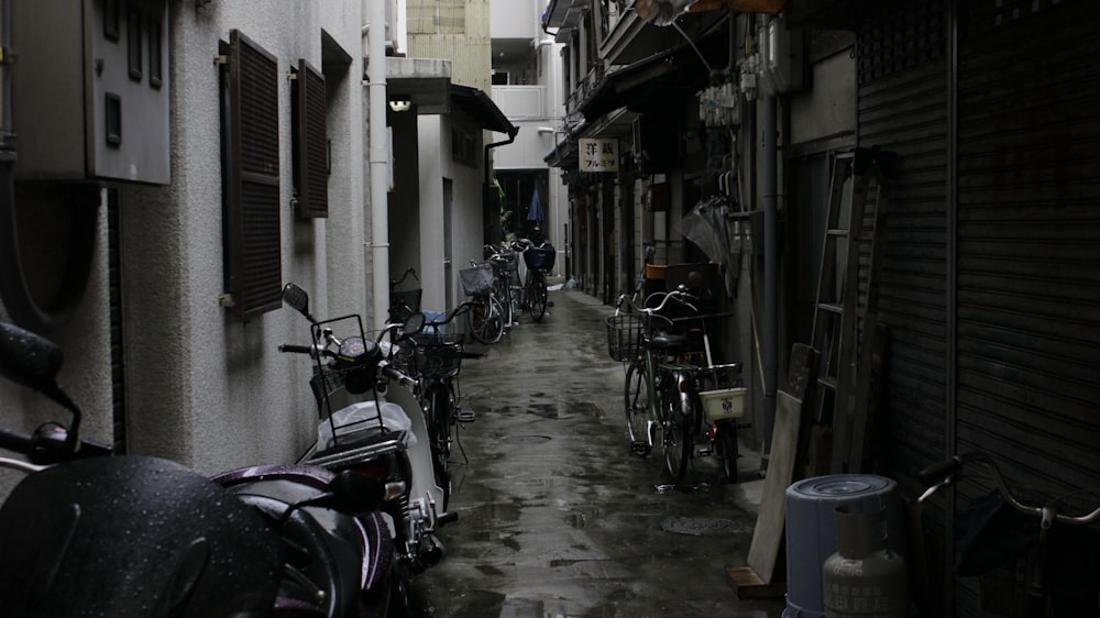 different motorcycles parking near concrete buildings