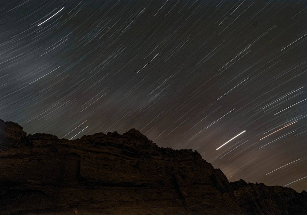 time lapse photography of mountain at night time