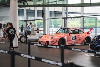 pink vehicle parked inside room