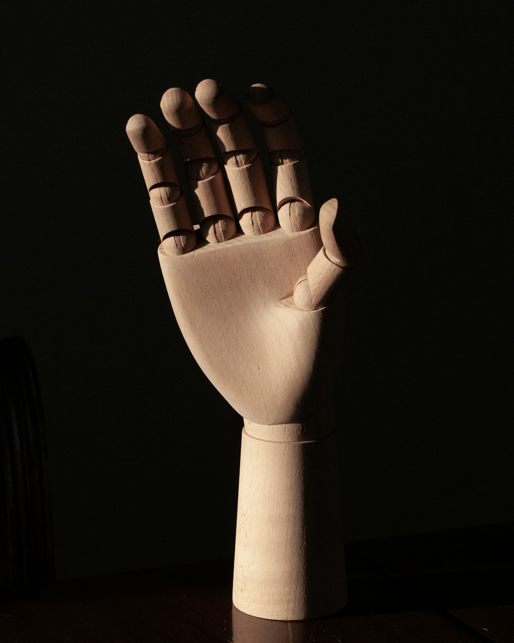 right human dummy hand on brown surface
