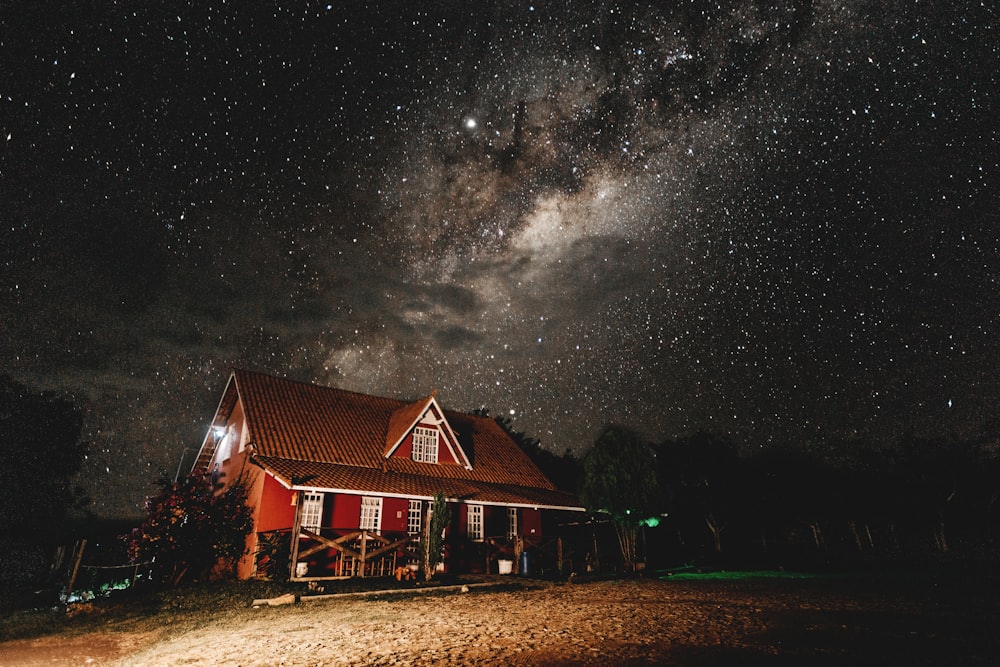 red wooden house at night time