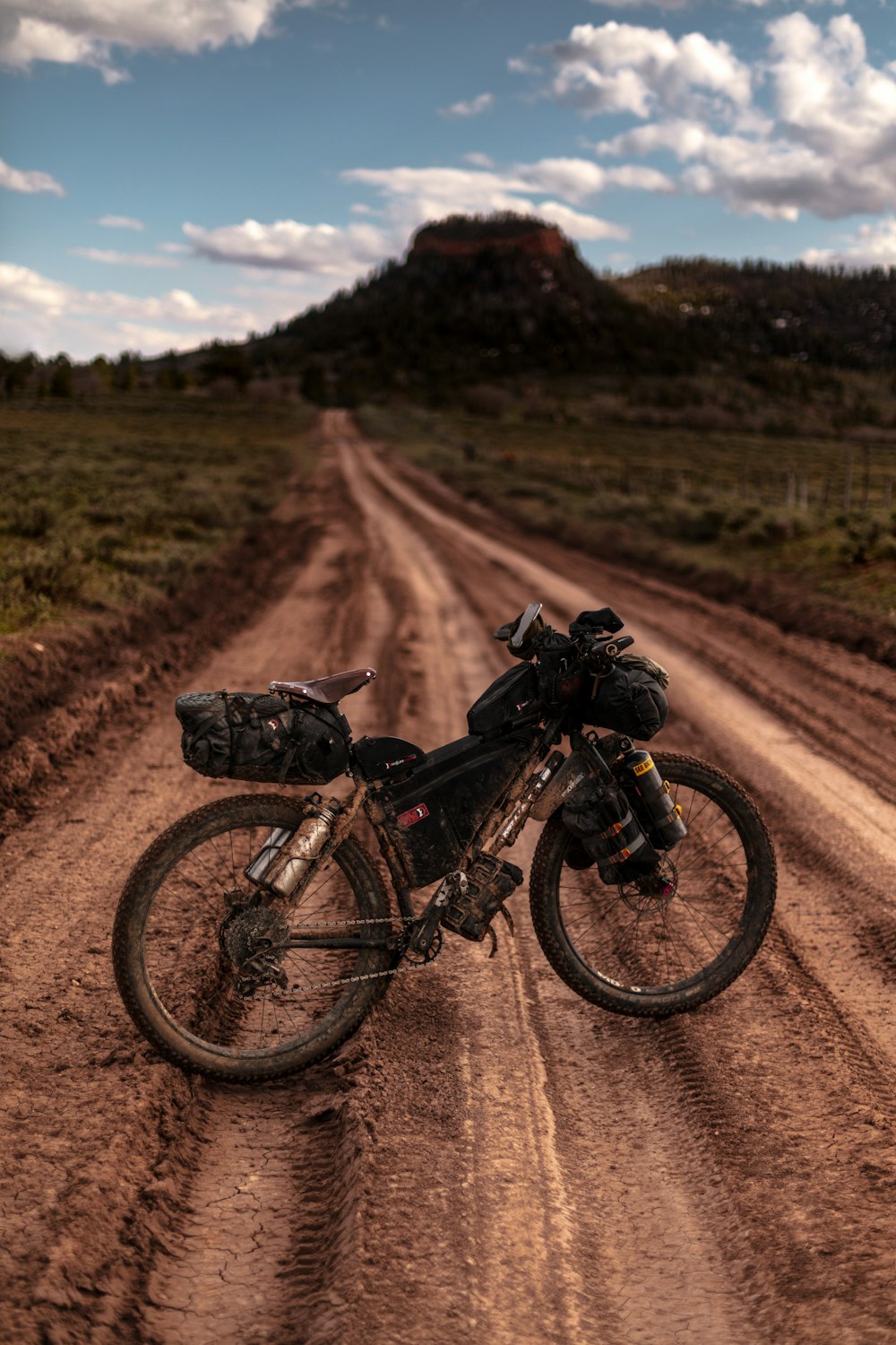 black motorized bicycle on dirt road