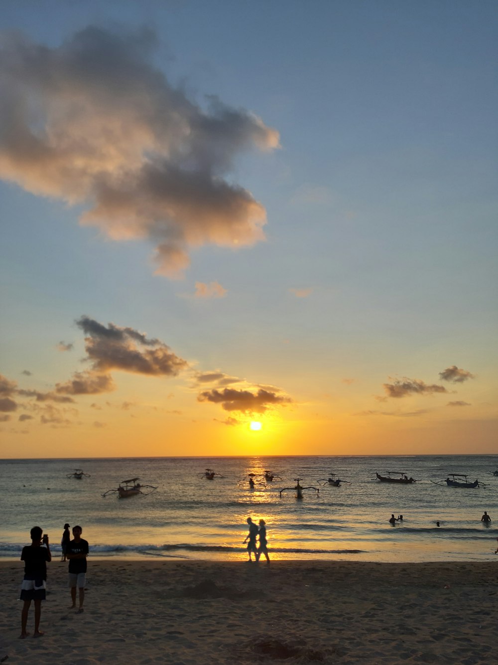 silhouette of people on shore