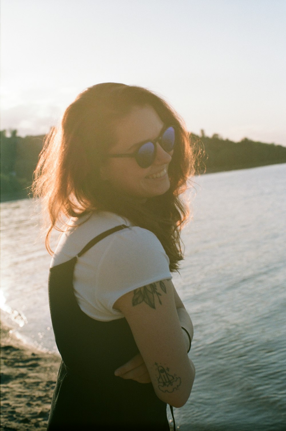 smiling woman staidness on shore