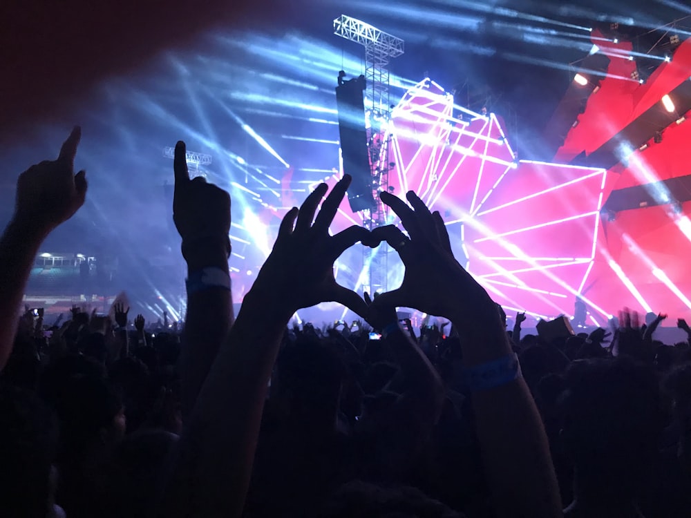 person making heart handsigns