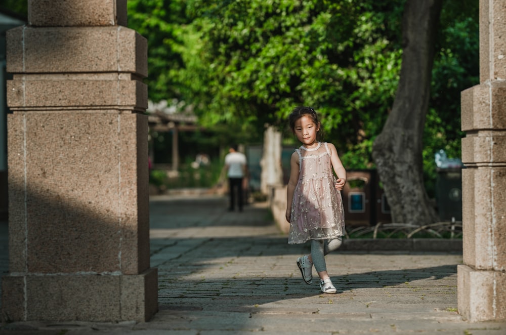 girl standing near gate