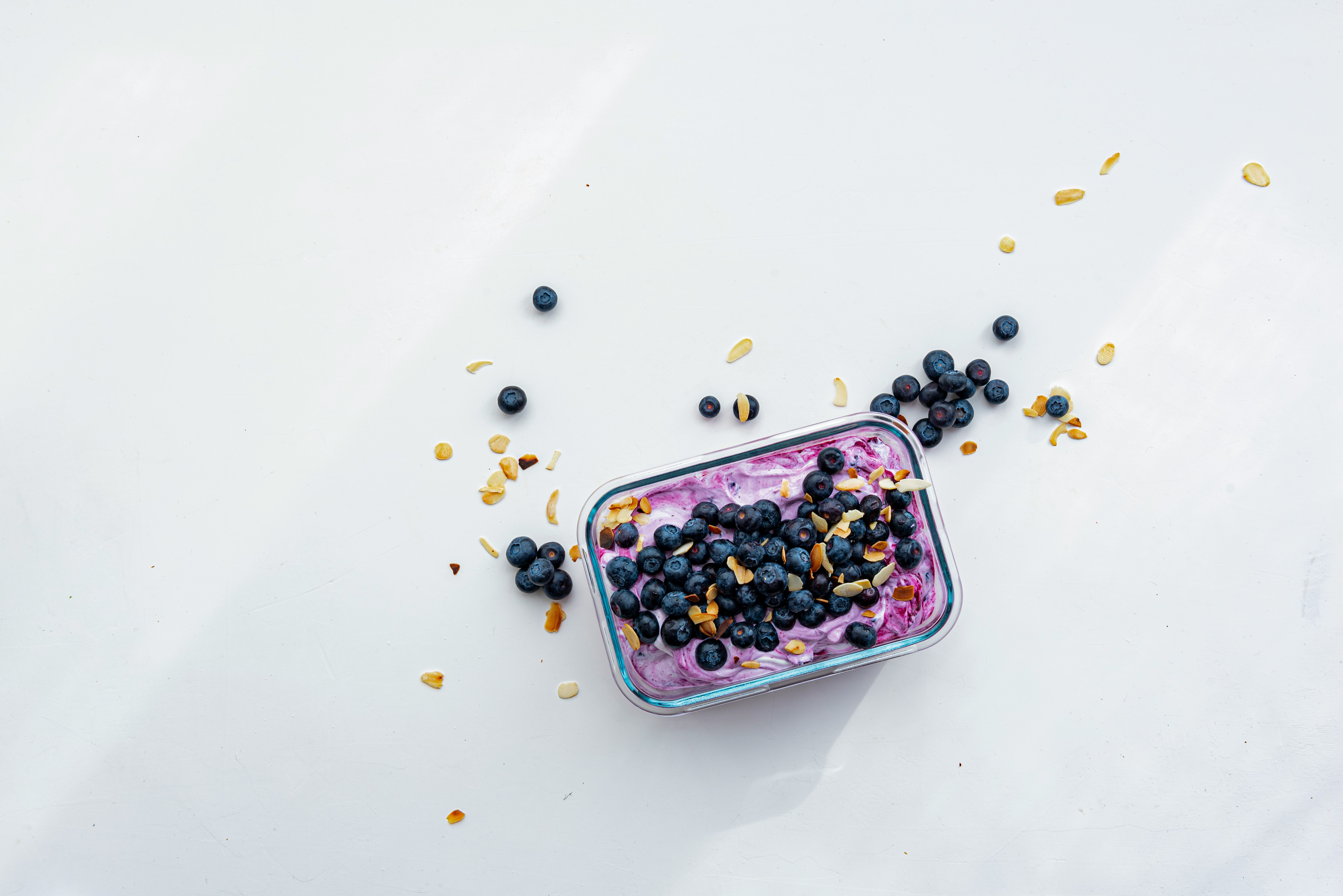 black berries on pink container