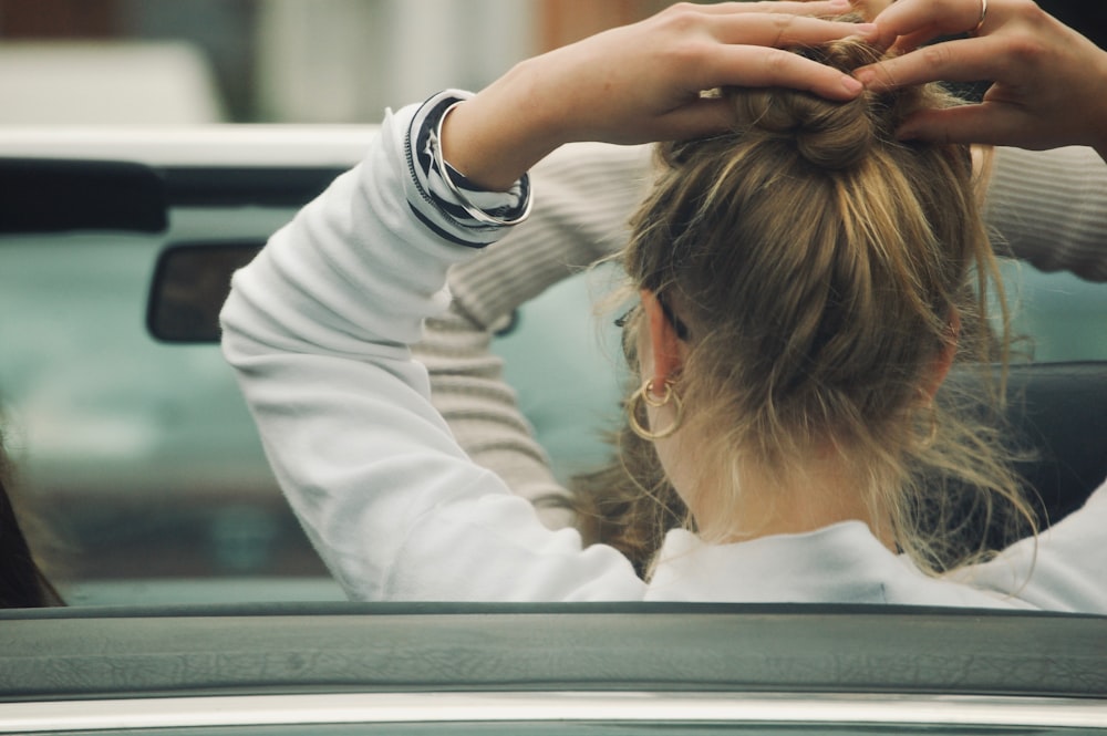 woman holding hair