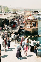 people walking near boat
