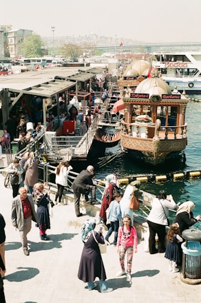 people walking near boat