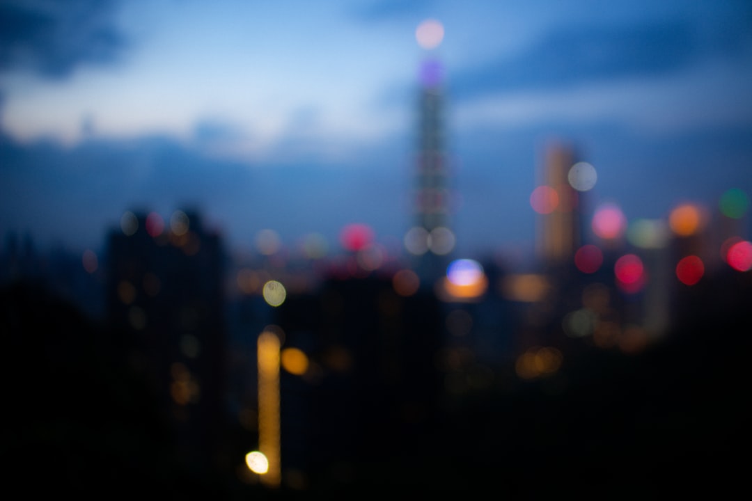 city buildings with red lights