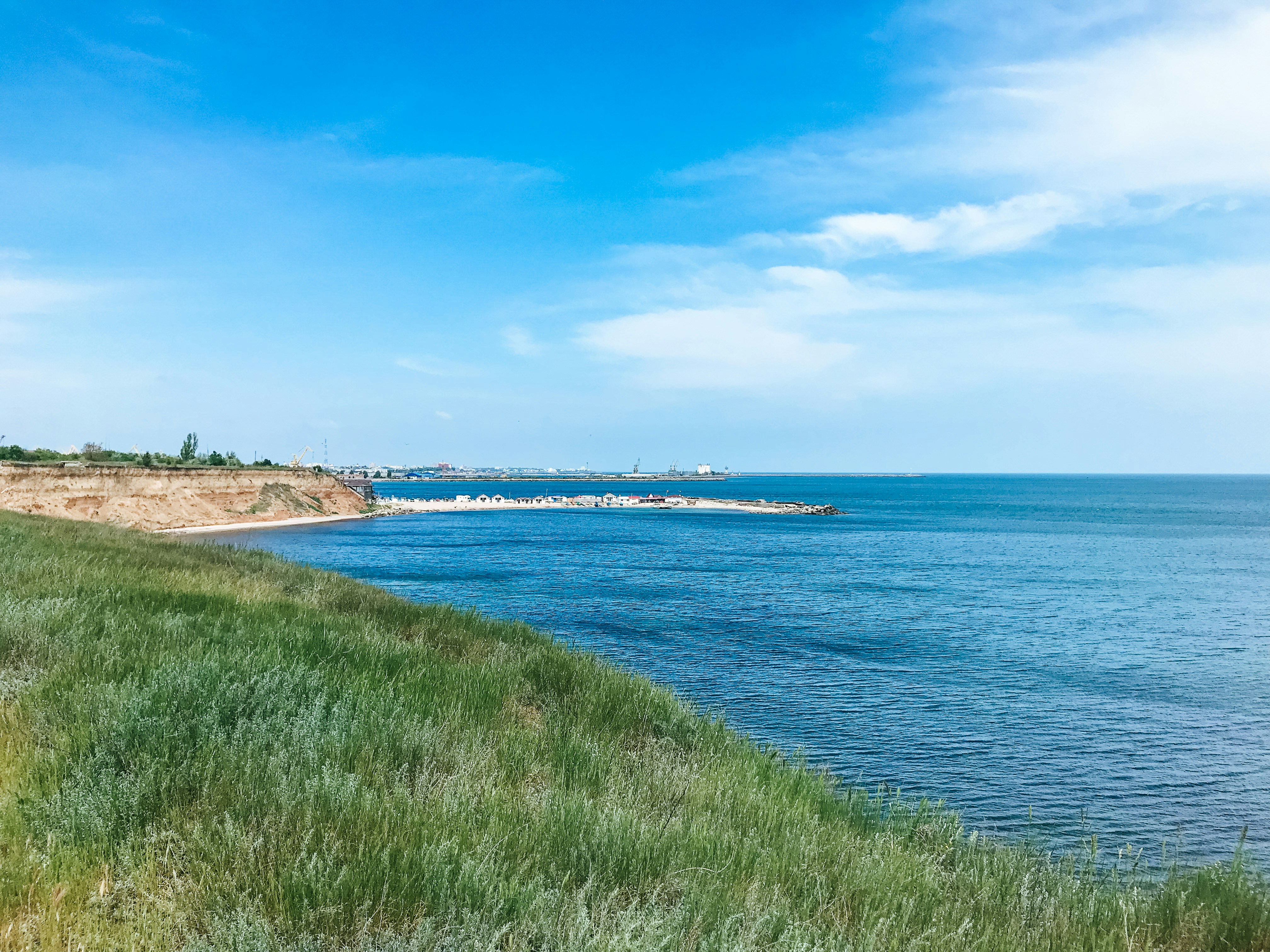 green grass covered beach, 