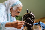 unknown person sewing indoors