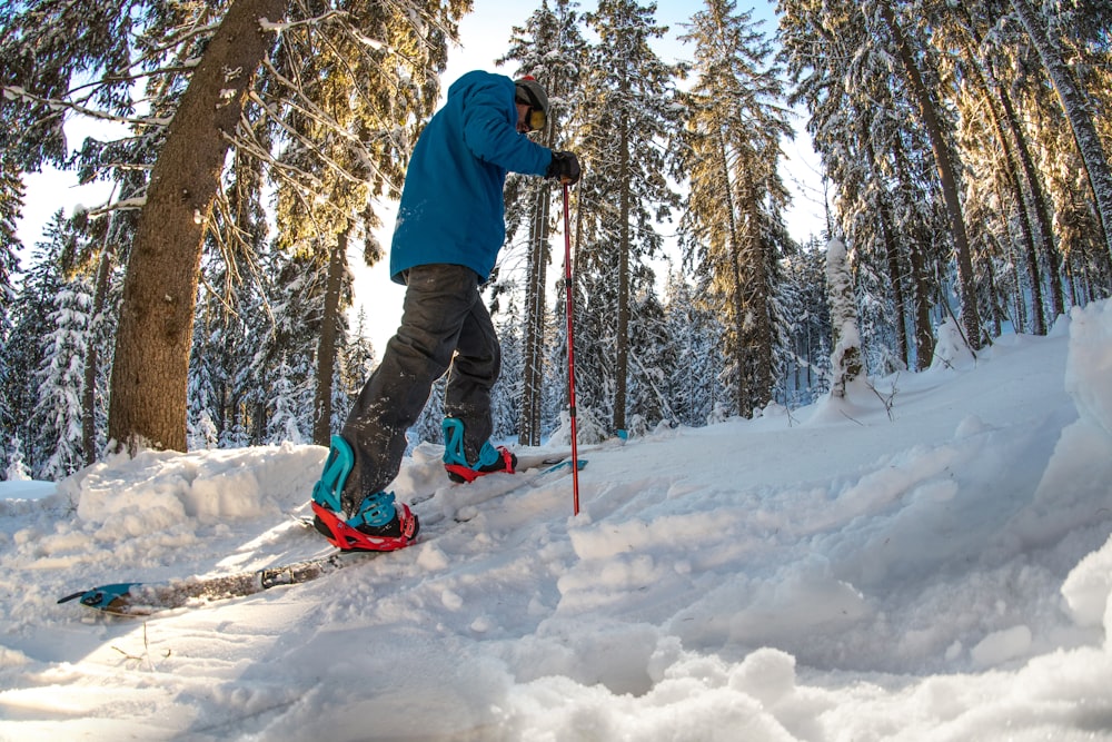 man holding red ski pole