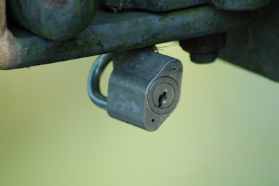 A locksmith repairing a padlock.