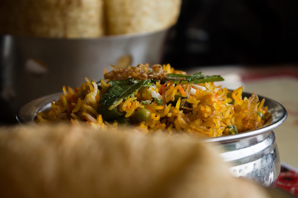 fried rice in gray bowl close-up photography