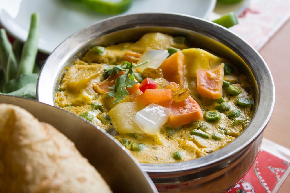 vegetable soup in gray bowl