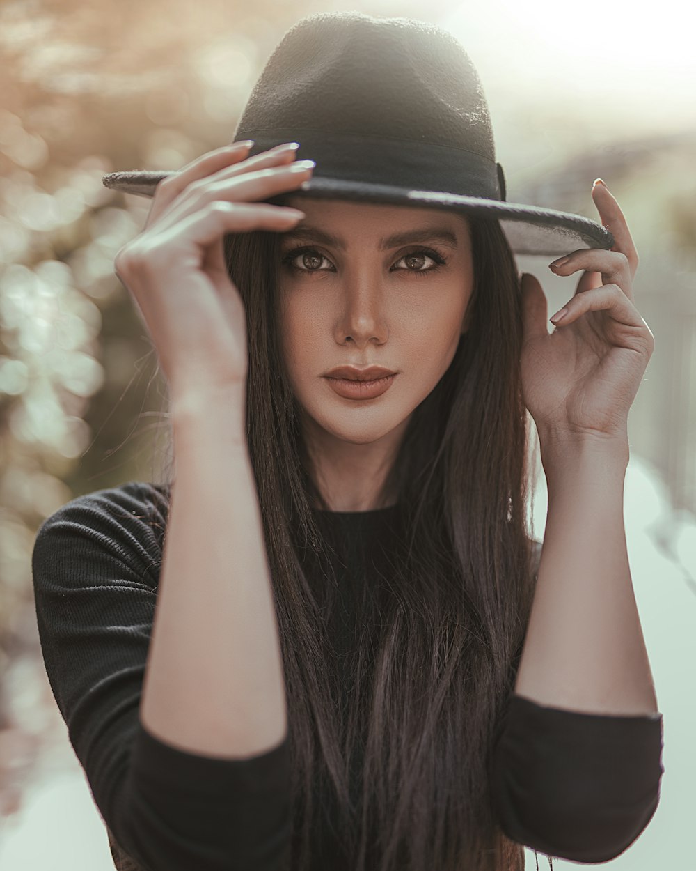 woman standing while wearing black suede hat