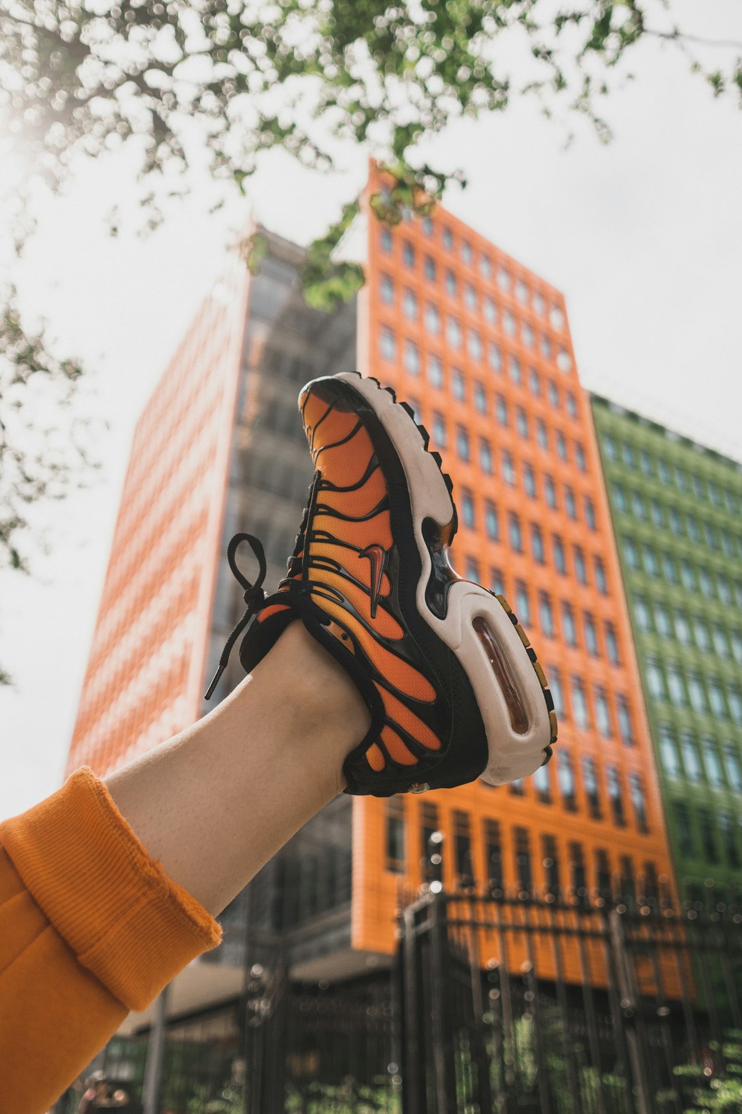 black and orange Nike basketball shoe close-up photography