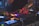 A DJ is mixing music on a professional DJ controller with multiple knobs and buttons. The scene is dimly lit, creating a vibrant and energetic atmosphere with colorful lights illuminating the equipment.
