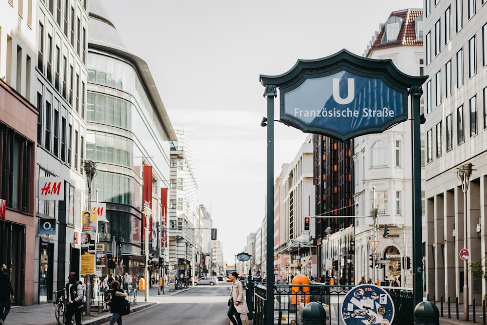 a city street with people walking on the sidewalk