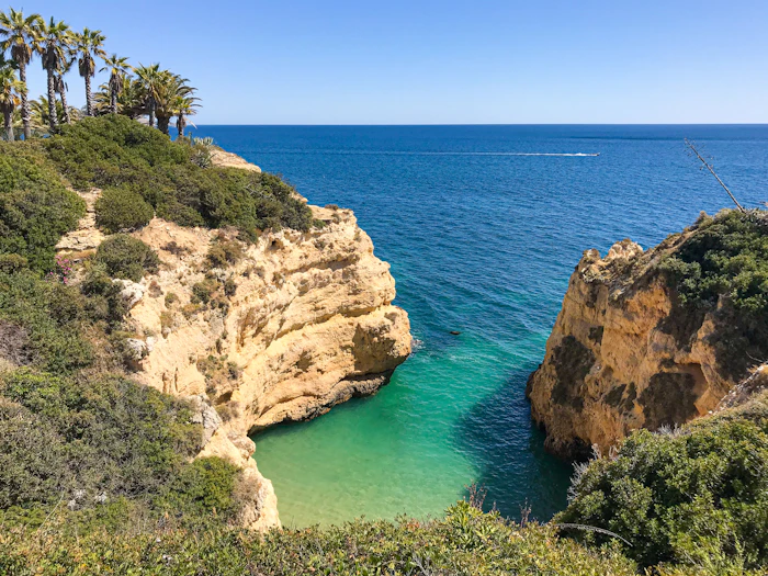 Limestone cliffs above a turquoise cove in the Algarve