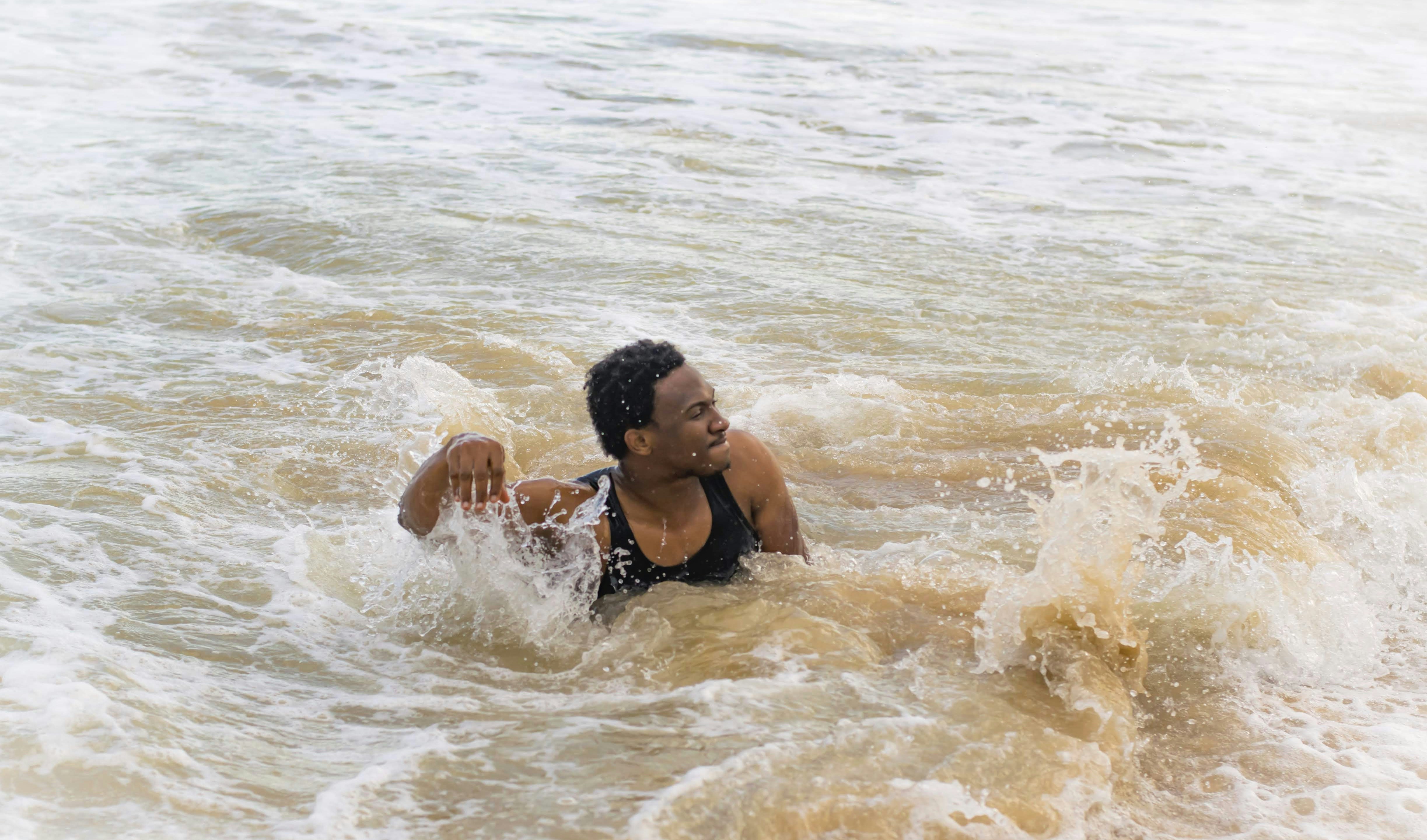 Man in running body of water photo Free Water Image on Unsplash