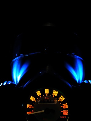 black vehicle speedometer
