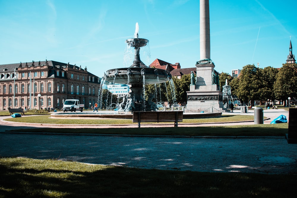 gray water fountain near brown structure