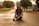 woman sitting on road