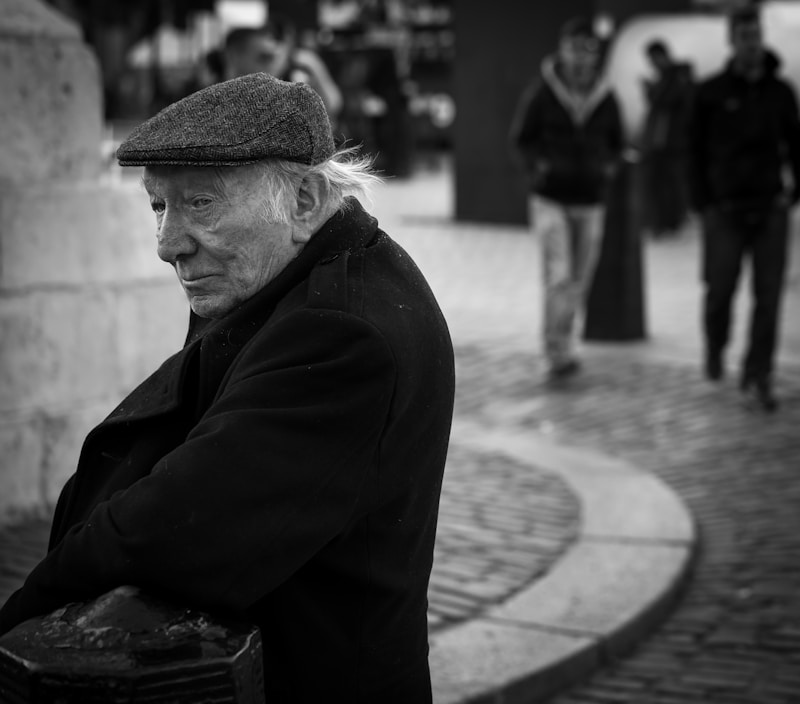Grayscale man in refined hat