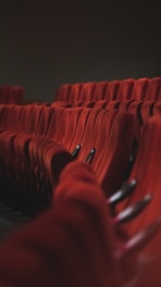 red fabric padded cinema chairs