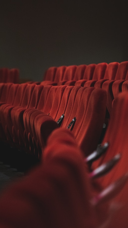 red fabric padded cinema chairs