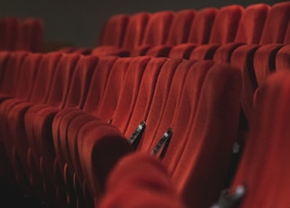 red fabric padded cinema chairs
