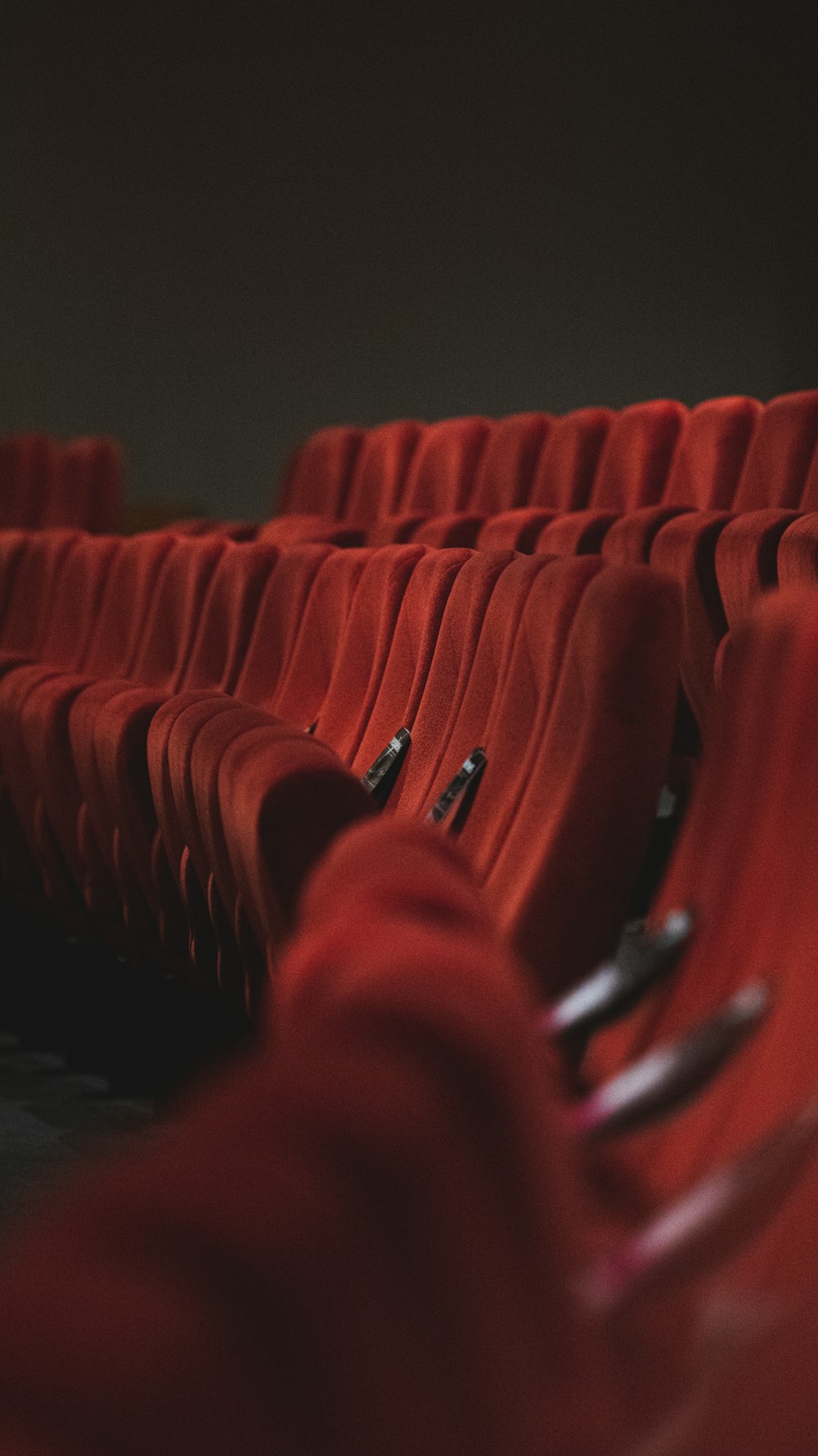 red fabric padded cinema chairs