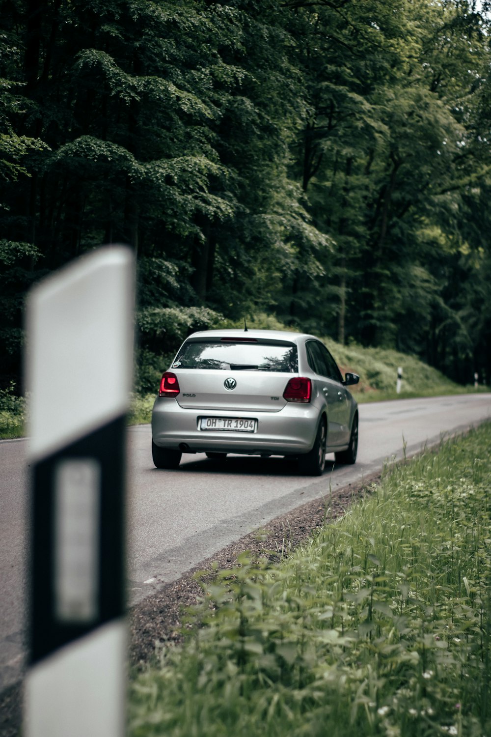 gray 5-door hatchback on road