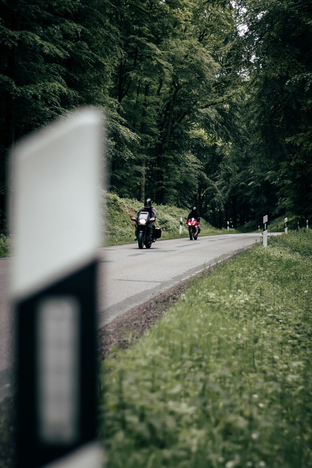 two person riding motorcycles