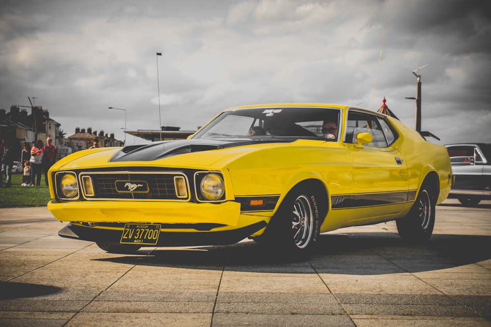 yellow Ford Mustang coupe