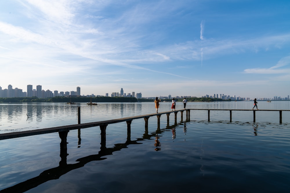 people standing on dock