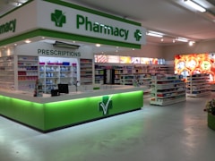 Pharmacists consulting with healthcare professionals in a bright clinic.