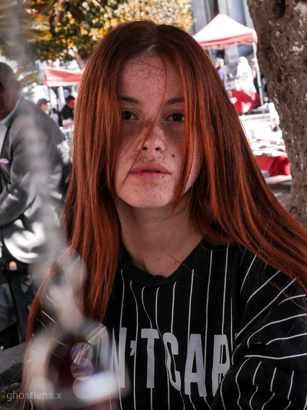 woman in black and white striped shirt