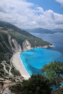 birds eye photography of body of water near mountain