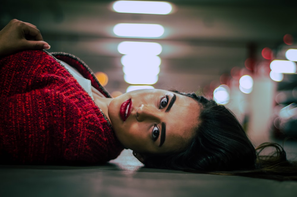 girl lying on parking area