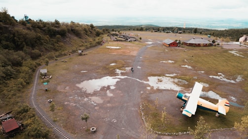 Aerial view of the hangar complex surrounded by green areas.