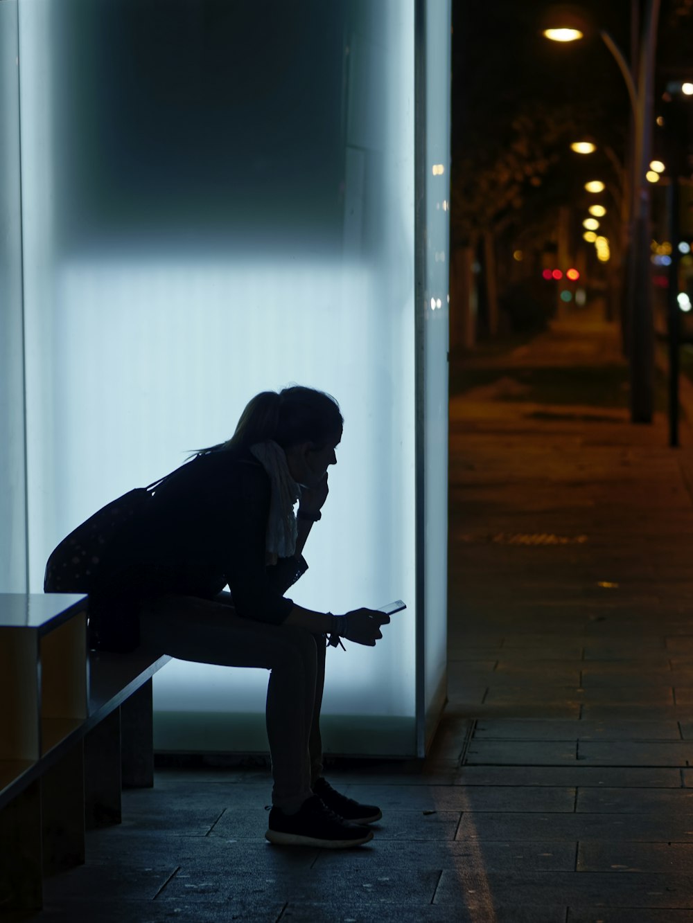 woman sitting on bench