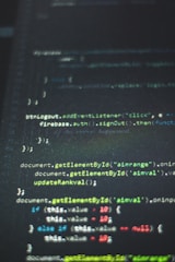 Close-up of code on a dark screen with green syntax highlighting.