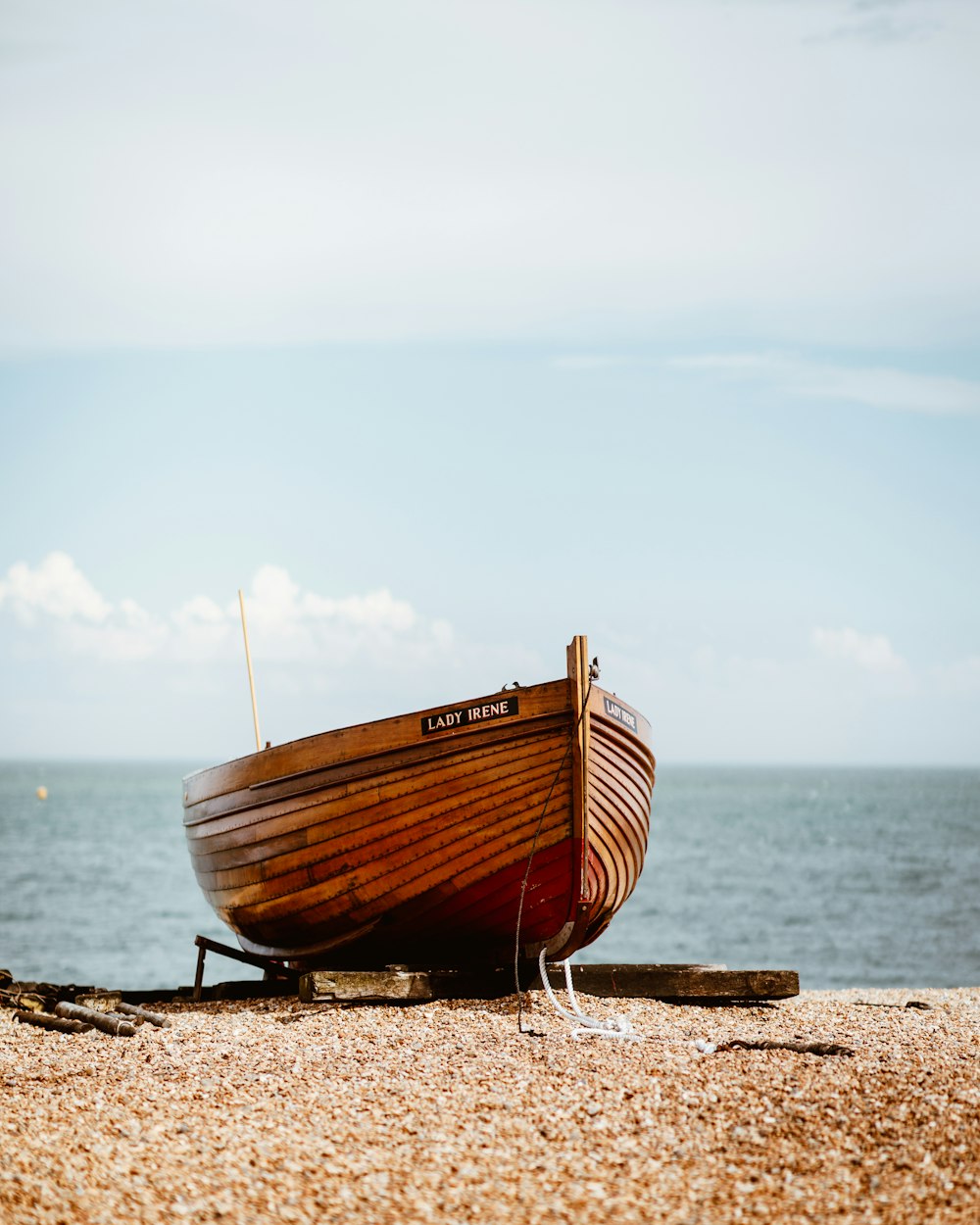 brown boat near body of water