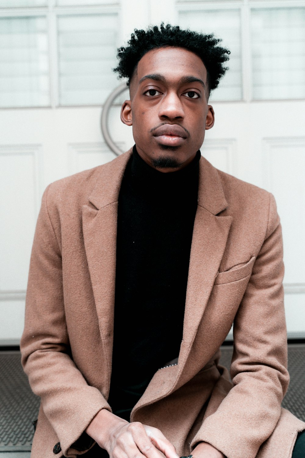 man wearing brown blazer photo