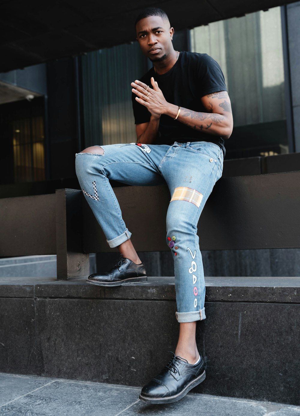 man sitting on concrete steps