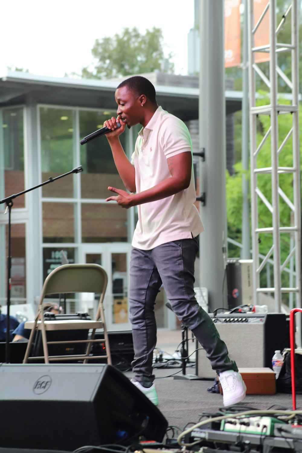 man singing on stage